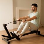 Explore rowing's benefits and which muscles a rowing machine works through each phase of the stroke.