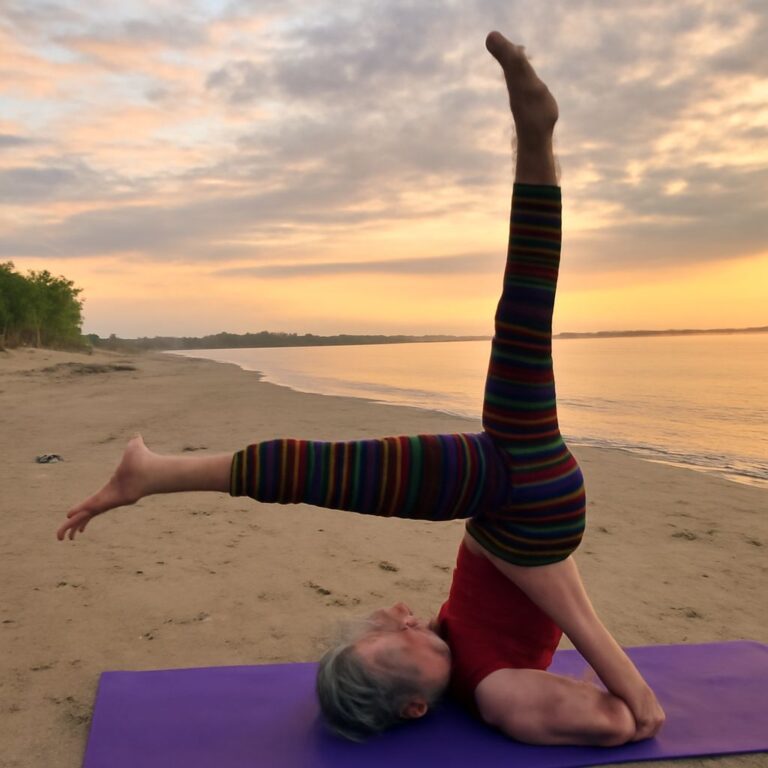 Demonstrating the shoulder stand yoga pose and yoga shoulder stand