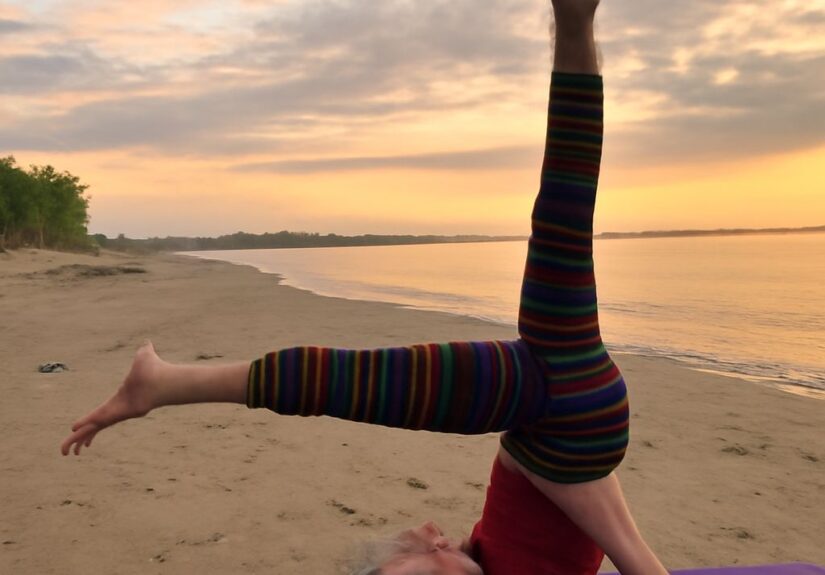 Demonstrating the shoulder stand yoga pose and yoga shoulder stand